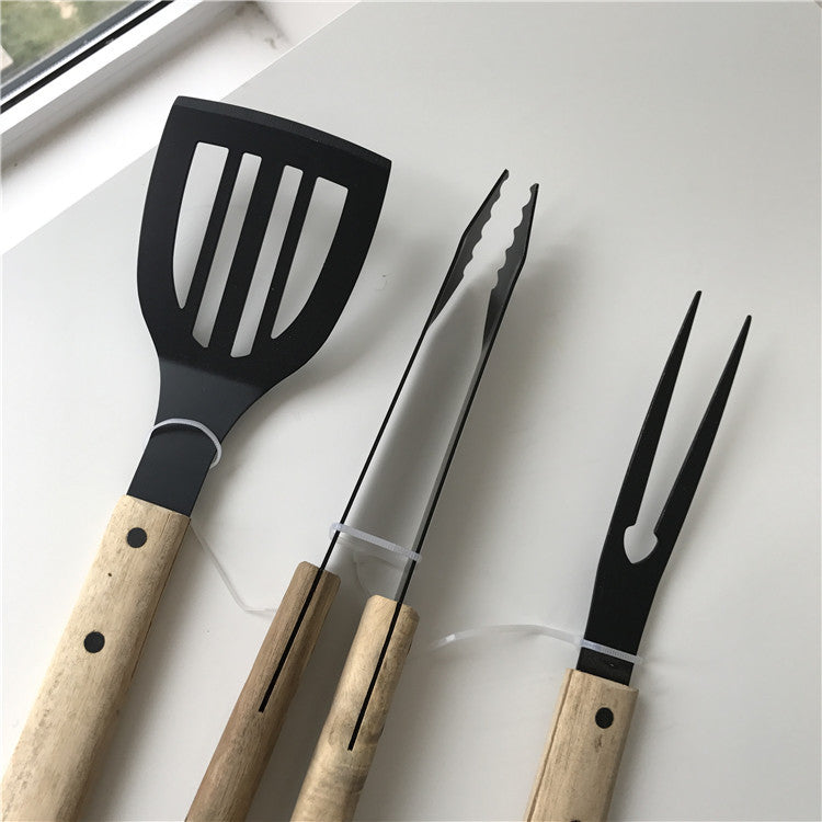 Wooden grill set with meat fork, tongs and spatula